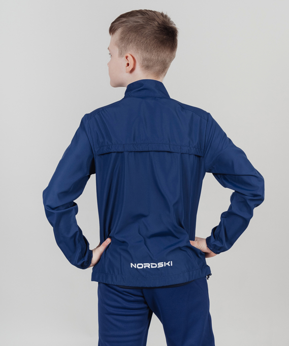 картинка Куртка ветрозащитная Nordski Jr. Motion Navy/Red от магазина Одежда+